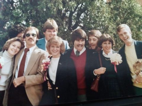 Brothers and their dates outdoors, the women wearing corsages